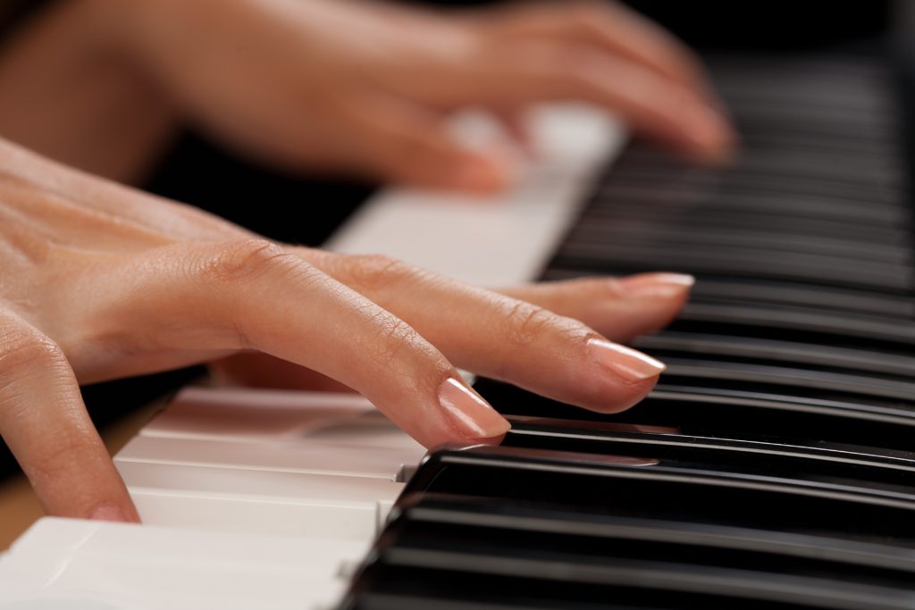 Piano player closeup on hands