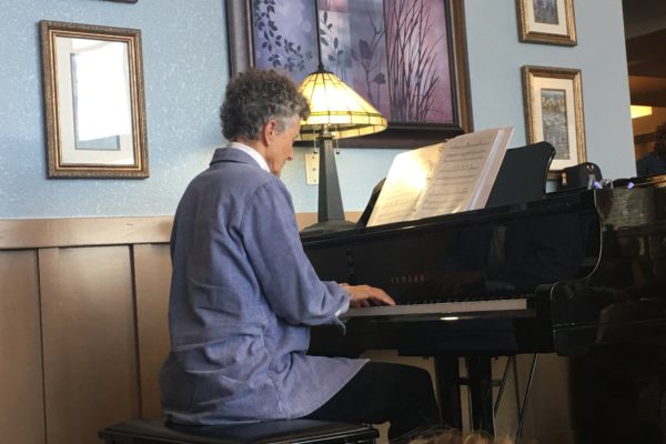 Adult playing piano